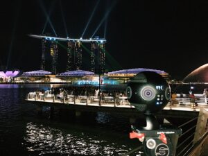 insta360 pro on a tripod with marina bay in the background